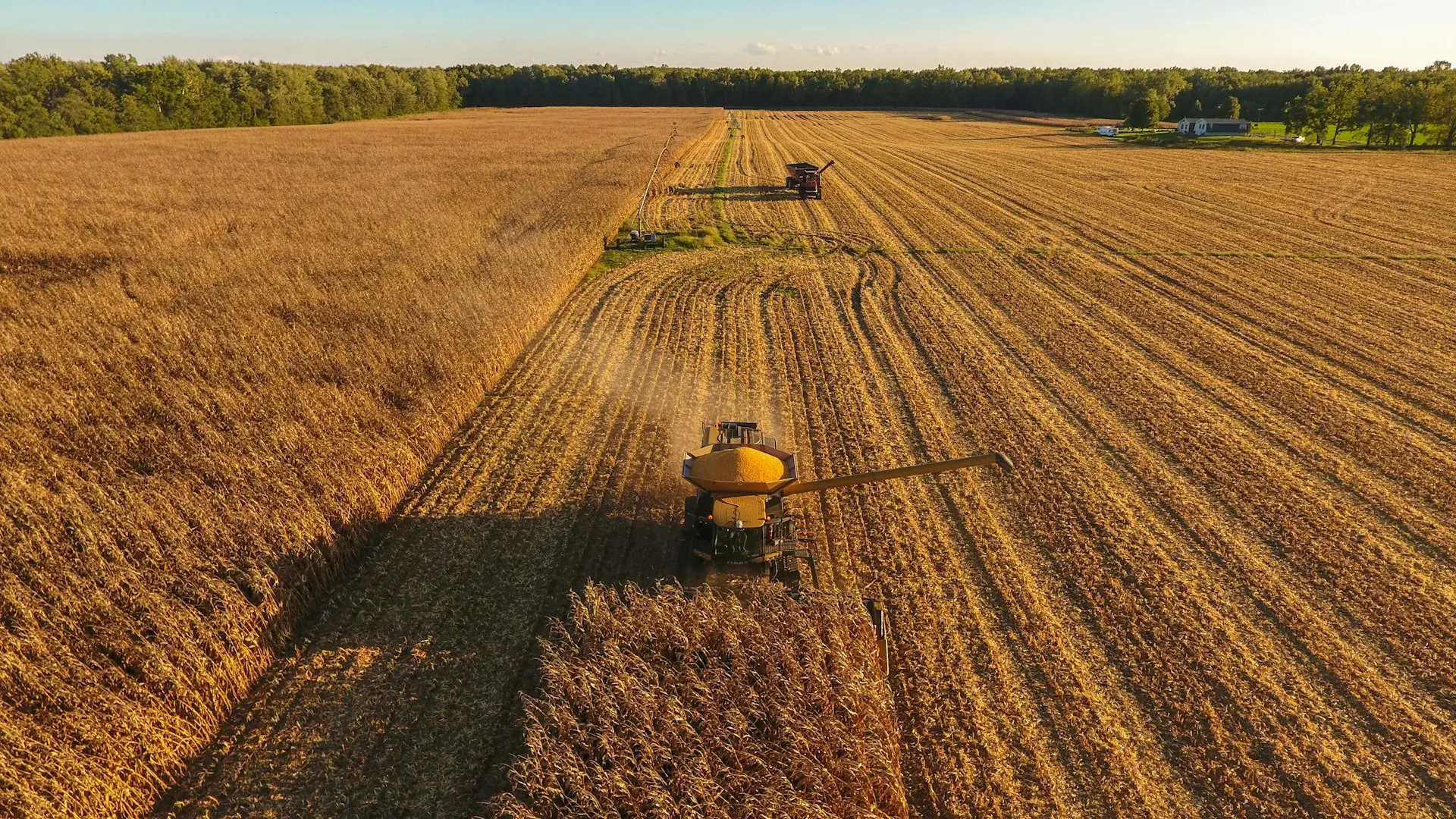 a tractor is driving through a large field